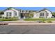 Beautiful single-story home features a manicured lawn, sidewalk, and neutral color palette at 19910 E Vallejo St, Queen Creek, AZ 85142