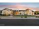 Striking single-story home displaying beautiful stonework, elegant white accents, and professional lighting at 19910 E Vallejo St, Queen Creek, AZ 85142