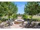 Charming fire pit area with comfortable seating, creating a cozy and inviting outdoor space for residents at 19910 E Vallejo St, Queen Creek, AZ 85142