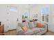 Cozy living space with a comfortable sofa and lots of natural light from the well-placed windows at 19910 E Vallejo St, Queen Creek, AZ 85142