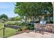 Outdoor grill station featuring a built-in grill and ample counter space, set amidst manicured landscaping at 19910 E Vallejo St, Queen Creek, AZ 85142