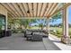 Relaxing outdoor seating area with plush sofas, offering views of the well-maintained grounds at 19910 E Vallejo St, Queen Creek, AZ 85142