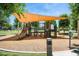 Community playground featuring slides and climbing structures with a shaded play area at 19910 E Vallejo St, Queen Creek, AZ 85142