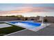 Backyard featuring a stunning pool with spa and basketball hoop, perfect for summer fun at 19910 E Vallejo St, Queen Creek, AZ 85142