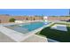 Stunning backyard features a sparkling pool, relaxing hot tub, and an adjacent basketball court for recreation at 19910 E Vallejo St, Queen Creek, AZ 85142