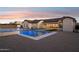 Backyard featuring a sparkling pool with spa, lounge area, and sport court perfect for outdoor activities at 19910 E Vallejo St, Queen Creek, AZ 85142
