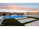 Backyard featuring a stunning pool with spa, sport court and basketball hoop, creating a fun and active outdoor space at 19910 E Vallejo St, Queen Creek, AZ 85142