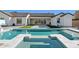 Beautiful pool and spa with lush artificial turf, complemented by a spacious backyard designed for entertaining at 19910 E Vallejo St, Queen Creek, AZ 85142