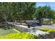 Community entrance sign for Whitewing at Whisper Ranch surrounded by lush greenery and water feature at 19910 E Vallejo St, Queen Creek, AZ 85142