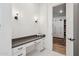 Bathroom vanity with a makeup counter that leads to a closet at 19910 E Vallejo St, Queen Creek, AZ 85142