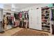 Spacious walk-in closet with built-in shelving and ample storage for clothing and shoes at 19910 E Vallejo St, Queen Creek, AZ 85142