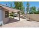Enjoy this covered patio, water feature, and BBQ grill in this well-manicured backyard at 2053 W Natal Cir, Mesa, AZ 85202