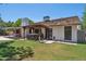 Charming home with a backyard, patio, hot tub, and lush green lawn at 2053 W Natal Cir, Mesa, AZ 85202