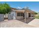 Backyard features a covered patio and paved area at 2053 W Natal Cir, Mesa, AZ 85202