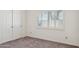 Bedroom features neutral carpet, white walls and shutters at 2053 W Natal Cir, Mesa, AZ 85202