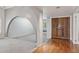 Bright entryway showcases hardwood floors, arched doorways, and decorative double doors at 2053 W Natal Cir, Mesa, AZ 85202