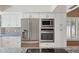 Gourmet kitchen boasting stainless steel appliances, granite countertops, and custom cabinetry at 2053 W Natal Cir, Mesa, AZ 85202