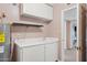Laundry room with sink and cabinets at 2053 W Natal Cir, Mesa, AZ 85202