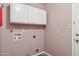 Laundry room featuring hookups and storage cabinets at 2053 W Natal Cir, Mesa, AZ 85202