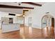 Open concept living area featuring hardwood floors, white walls, and modern kitchen at 2053 W Natal Cir, Mesa, AZ 85202