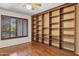 Office features built-in shelving, a ceiling fan and wooden shuttered windows at 2053 W Natal Cir, Mesa, AZ 85202