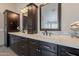 Bathroom features dual sink vanity with dark wood cabinets, stone countertops, and tile backsplash at 20809 N 17Th St, Phoenix, AZ 85024