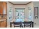 Bright dining area overlooking the pool with direct access to a covered patio at 20809 N 17Th St, Phoenix, AZ 85024