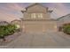 Stunning two-story home with a three-car garage, desert landscaping, and sunset views at 20809 N 17Th St, Phoenix, AZ 85024