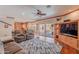 Open living room boasts hardwood floors, media center, and sliding doors to the backyard pool and patio at 20809 N 17Th St, Phoenix, AZ 85024