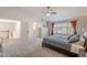 Bright main bedroom features vaulted ceiling, neutral carpet, and large windows for lots of natural light at 20809 N 17Th St, Phoenix, AZ 85024
