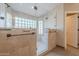 Bathroom features tiled shower with glass doors, and glass block window for natural light at 20809 N 17Th St, Phoenix, AZ 85024