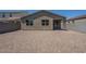 Backyard featuring a neutral-colored single-story home, a gravel-covered yard, and block wall at 297 W Nikita Dr, San Tan Valley, AZ 85140