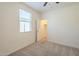 Bedroom featuring plush carpet, natural light, and access to a large walk-in closet at 297 W Nikita Dr, San Tan Valley, AZ 85140