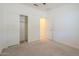An empty bedroom with carpet flooring, a ceiling fan, and sliding closet doors at 297 W Nikita Dr, San Tan Valley, AZ 85140