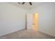 Bedroom featuring plush carpet, ceiling fan, and access to a large closet at 297 W Nikita Dr, San Tan Valley, AZ 85140