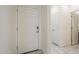 Clean and bright entryway with neutral tile flooring, leading to additional rooms at 297 W Nikita Dr, San Tan Valley, AZ 85140