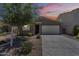 Charming single-story home featuring a well-manicured front yard and a two-car garage at 297 W Nikita Dr, San Tan Valley, AZ 85140