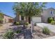 Single-story home featuring desert landscaping, an attached two-car garage, and inviting curb appeal at 297 W Nikita Dr, San Tan Valley, AZ 85140
