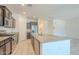 Modern kitchen featuring stainless steel appliances, a granite island, and sleek cabinetry at 297 W Nikita Dr, San Tan Valley, AZ 85140