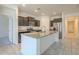Spacious kitchen featuring granite countertops, stainless steel appliances, and dark cabinetry at 297 W Nikita Dr, San Tan Valley, AZ 85140