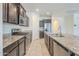 Well-equipped kitchen featuring stainless steel appliances, granite countertops, and ample cabinet space at 297 W Nikita Dr, San Tan Valley, AZ 85140