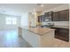 Modern kitchen featuring granite countertops, stainless steel appliances, and an open design at 297 W Nikita Dr, San Tan Valley, AZ 85140