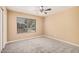 Bedroom with carpet, ceiling fan, window with blinds and closet for storage at 3343 W Lone Cacuts Dr, Phoenix, AZ 85027