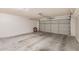Spacious two car garage featuring a concrete floor and an automatic garage door at 3343 W Lone Cacuts Dr, Phoenix, AZ 85027