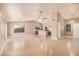 Open living space features tile floors, ceiling fans, neutral paint, and a kitchen at 3343 W Lone Cacuts Dr, Phoenix, AZ 85027