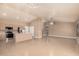 Expansive living room featuring tile floors, neutral paint, and stainless steel appliances at 3343 W Lone Cacuts Dr, Phoenix, AZ 85027