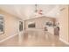 Spacious living room with tile floors, sliding glass doors, ceiling fans, and neutral paint at 3343 W Lone Cacuts Dr, Phoenix, AZ 85027