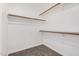 Walk-in closet featuring ample storage with shelving and clothing racks at 3343 W Lone Cacuts Dr, Phoenix, AZ 85027