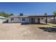 Backyard view of a home featuring a covered patio and access to a detached garage at 3347 W Roma Ave, Phoenix, AZ 85017
