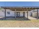 Exterior backyard with a covered patio and a combination of grass and dirt at 3347 W Roma Ave, Phoenix, AZ 85017